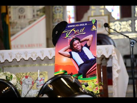 Desi Jones’ portrait, beret and drums at his thanksgiving service held on Monday at the Cathedral of The Most Holy Trinity in Kingston. 