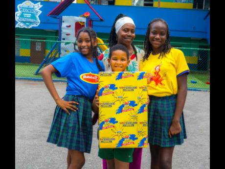 Credit: Contributed Students of Meadowbrook Prep pose with educator Mrs Braham (centre) as they hope to win $300,000 in the ‘Risk it for the Biscuit’ Butterkist competition.