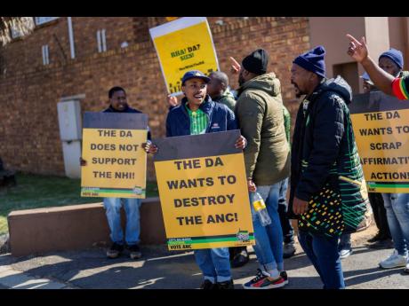 African National Congress (ANC) party members protest as South African president Cyril Ramaphosa meets with senior officials of the ANC during the ANC’s National Executive Committee Thursday, June 6, in Johannesburg.