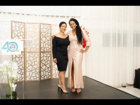 Credit: Contributed Keila McKenzie (left), chief executive officer, O&D Pest Control, with Simone Spence Johnson, president of the Manchester Chamber of Commerce, following the El Instituto de Mandevilla 40th Anniversary Homecoming and Awards Banquet, held at the Golf View Ho