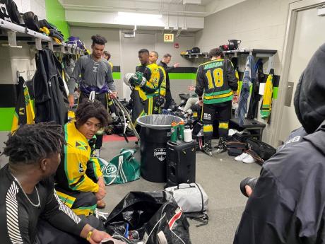 Members of Jamaica’s ice hockey team take a load off after intense competition in the Challenge Series against Puerto Rico and Lebanon in Long Island last week.