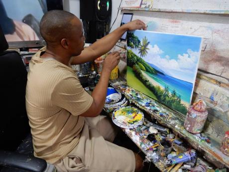 Jerome Taylor at work at Hava’s Art World. 