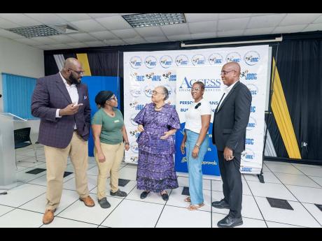 From left; Jamaica Business Development Corporation (JBDC) Deputy Chief Executive Officer Harold Davidson, JBDC Deputy Board Chairman Steven Fong-Yee, Access Financial Services (AFS) customer and small business owner Geraldine Gordon-Fearron, JBDC CEO Valr