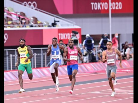 Canada’s Andre De Grasse (right) wins the men’s 200 metres final in 19.62 seconds at the Tokyo 2020 Olympics  at the Tokyo Olympic Stadium on Wednesday, August 4, 2021. At left is Jamaica’s Rasheed Dwyer who placed seventh in the final in 20.21.