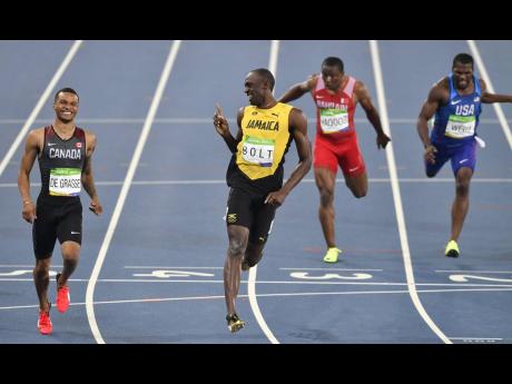 Jamaica’s Usain Bolt (centre left)  and Canada’s Andre De Grasse (left)  compete in a men’s 200m semifinal during the athletics competition of the 2016 Summer Olympics at the Olympic Stadium in Rio de Janeiro, Brazil, Wednesday, August 17, 2016. 