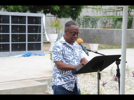  Rolborne Barrett speaking during a ceremony on Saturday to officially dedicate the columbarium established at Boulevard Baptist Church in St Andrew.
