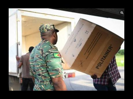 Loading aircraft with supplies for Grenada. 