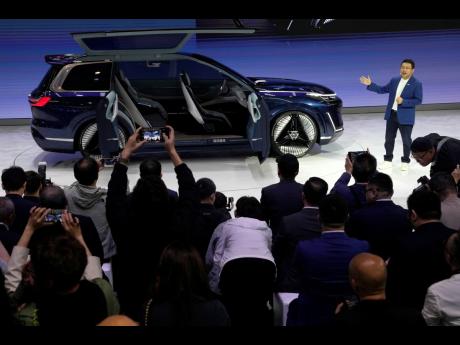 Credit: AP Ng Han Guan
Jerry Gan, CEO of Geely Auto Group, unveils the Galaxy Starship, a new technology flagship AI-driven SUV prototype during Auto China 2024 in Beijing, on April 25, 2024.