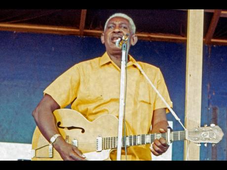 Credit: AP Arthur Crudup performing in Ann Arbor, Michigan on Sunday, August 3, 1969. Crudup wrote the song ‘That’s All Right’, which Elvis Presley later recorded for his first single.