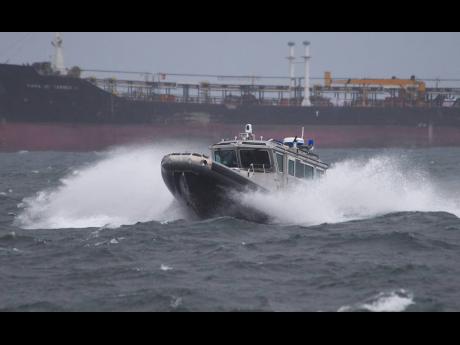 Credit: File A Jamaica Defence Force (JDF) coastguard boat hitting huge waves in the Kingston Harbour. The JDF announced that it has launched a search and rescue mission to find 11 fishermen who have been reported missing since Tuesday. The Maritime Air and Cyber Comma