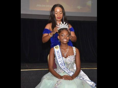 Miss Tourism Jamaica 2023 Andreka Nelson (back) crowns the new queen, Jolon Dewer.