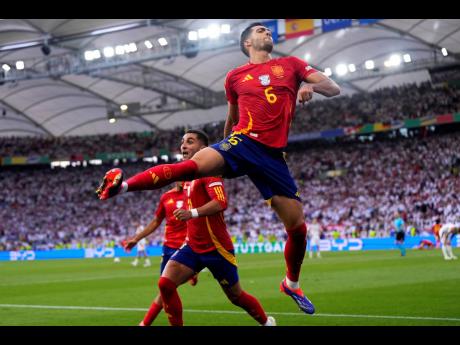 Spain’s Mikel Merino celebrates after scoring his sides second goal during a Euro 24 quarter-final match against Germany in Stuttgart, Germany, on Friday.