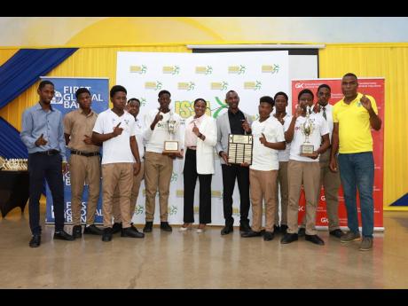 First Global Bank’s Chief Operating Officer, Terry Ann Graver (centre), is joined by General Manager of GK General Insurance Chaluk Richards at the awards luncheon of the 2024 GK Financial Group/ISSA Schoolboy Cricket Competition, held recently at the Wo