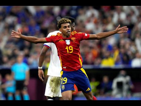 Spain’s Lamine Yamal reacts after scoring during a semifinal match between Spain and France at the Euro 2024  tournament in Munich, Germany on Tuesday, July 9, 2024.