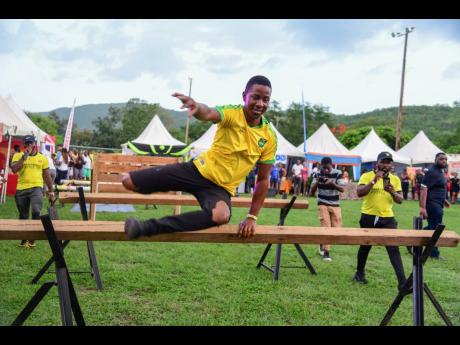 Credit: Antoine Lodge Lethan Kerr leaped over the penultimate hurdle in the SamRock Obstacle Course.