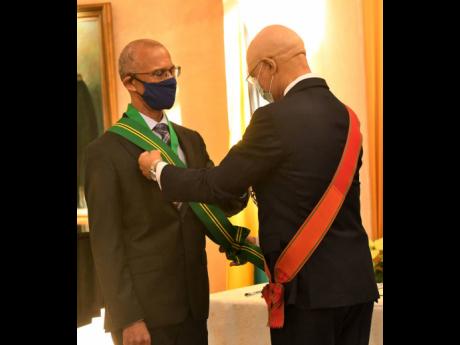 Credit: File In this December 2020 file photo, Governor General Sir Patrick Allen (right) presents the instrument of appointment to Justice Patrick Brooks after he was sworn in as president of the Court of Appeal at King’s House.