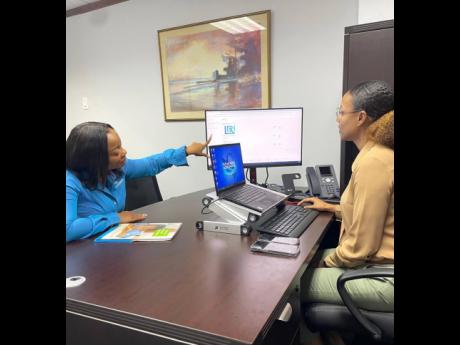 Credit: Vice-President of Capital Markets at Sagicor Investments Jamaica Limited, Mischa McLeod Hines (left), and Executive Vice-President and Chief Investment Officer at Sagicor Group Jamaica Limited, Tracy-Ann Spence, demonstrate the upgraded Sagicor eInvest pla