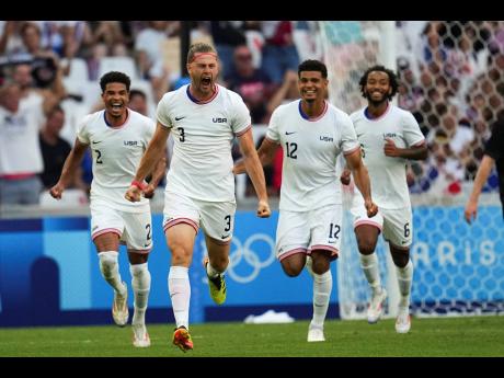 United States’ Walker Zimmerman, (centre) celebrates after scoring his side’s second goal during the men’s Group A football match against New Zealand at the Velodrome during the 2024 Summer Olympics, yesterday.