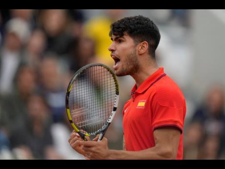 Carlos Alcaraz of Spain reacts after winning a set point against Hady Habib of Lebanon during the men’s singles tennis competition, at the 2024 Summer Olympics at Roland Garros yesterday.