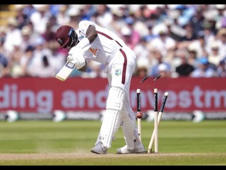 Credit: AP West Indies’ Alzarri Joseph is bowled by England’s Mark Wood during day three of the third Test match at Edgbaston in Birmingham, England, yesterday.