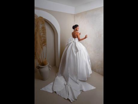 Crafted from Mikado satin, the breathtaking bow details to the back of Ashlie is a highlight of this luxurious ball gown.