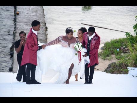 Glowing in the seventh month of her pregnancy, Michelle Thomas arrived at her wedding ceremony by boat.