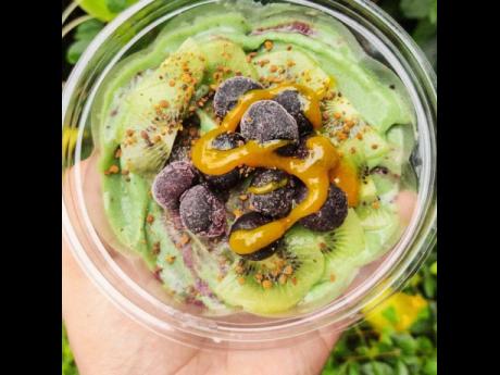 This is the acai and greens bowl topped with blueberry, turmeric, honey and bee pollen.