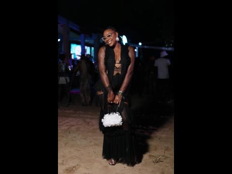 Living her best life, Krystal Tomlinson, CEO of Success Farm Life Academy, made a statement in a trendy mesh-layered tulle dress.