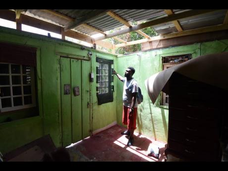 David Dockery stands in a section of his damaged house in Top Burnt Ground, St Elizabeth, last Thursday. He and his family have been staying at the Burnt Ground Seventh-day Adventist Church since Hurricane Beryl damaged their home, which is now falling apa