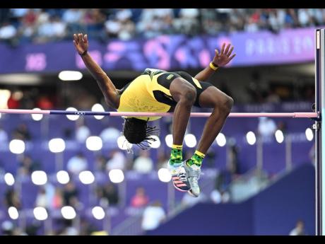 Romaine Beckford flying high during the men’s high jump final inside the Stade de France yesterday.