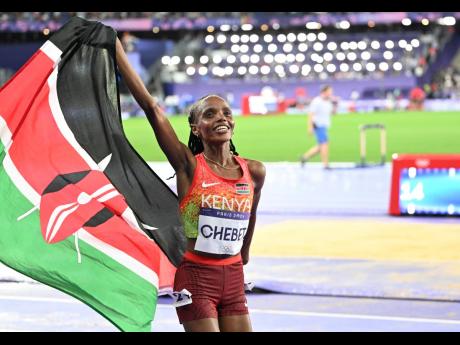 ‘Model/athlete’ Beatrice Chebet celebrates gold in the women’s 10,000 metres on Friday inside the Stade de France.
