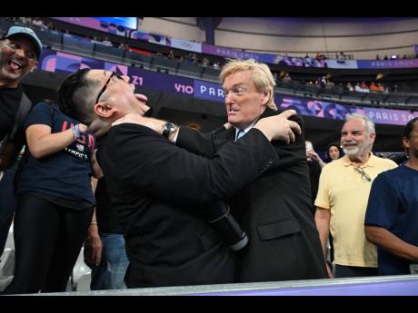 Best look-a-likes ever ‘Kim Jong-Un’ (left) and ‘Donald Trump’ engage in battle in the stands of the Stade de France at the Paris Olympics yesterday.