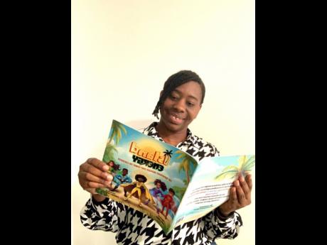 Author, Zola Hinds reads a copy of her book, ‘Island Energy’.