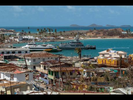 Homes sit destroyed by Hurricane Beryl on July 4, 2024, in Clifton, Union Island, St Vincent and the Grenadines, one of the markets in which Flow operates in the region.