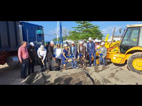Credit: Photo by Gareth Davis Sr Prime Minister Andrew Holness (fourth right) takes part in the groundbreaking for the construction of the Boundbrook Urban Centre in Portland yesterday, along with stakeholders including Daryl Vaz (left), member of parliament (MP) for Portland Western; Sen