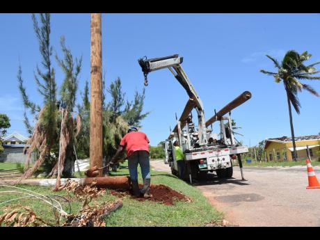 JPS personnel carrying out repairs to powerlines damaged by the passage of Hurricane Beryl in July. 