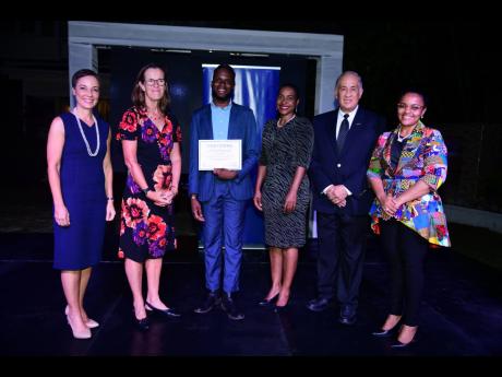 Credit: Antoine Lodge From left: Senator Kamina Johnson Smith, minister of foreign affairs and foreign trade; Judith Slater, British high commissioner to Jamaica; Najae Murray, recipient of the Chevening JN Oliver F. Clarke Scholarship; Marsha Smith, minister of state in the Mi