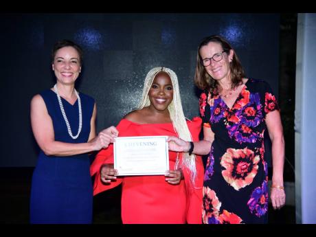 Credit: Antoine Lodge Senator Kamina Johnson Smith (left), minister of foreign affairs and foreign trade, and Judith Slater, British high commissioner to Jamaica, present Jomarie Malcolm Gordon with her certificate of acceptance at the 2024 Chevening Scholarship Award Ceremony