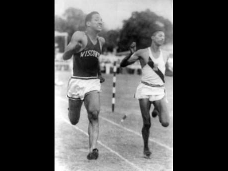 George Rhoden (left) shows his range, clocking 1:59.4 minutes to win an 800-metre race ahead of Panama’s Frank Price.