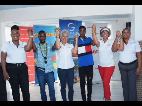 From left: Ophelia Wright, sales executive at Rainforest Seafoods; Eric Reid, client of The Committee for the Upliftment of the Mentally Ill (CUMI); Trina Delisser, chairperson of CUMI; Jordaine Brimm, client of CUMI; Kim Mair, CEO JMMB Joan Duncan Foundat