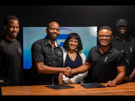 Credit: Contributed From left: iKon Media’s Wentworth Kelly and Horane Henry; film commissioner, Jacqueline Jackson; Creative Factory’s Jason McNeish and Gemmar McFarlane, pose for the camera as they seal the deal on the GoalPost collab.