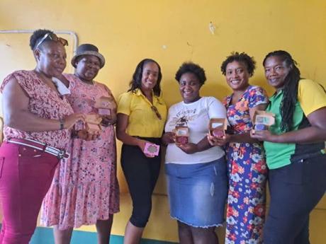 Local Economic Development Coordinator, Alicia Atkinson-Thomas (third left), with participants in the recent soapmaking workshop organised by the Social Development Commission at Rusea’s High School in Hanover.