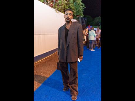 Left: Creative Rushane ‘Rushcam’ Campbell nailed a relaxed yet stylish look, pairing a double-breasted jacket with wide-leg trousers.