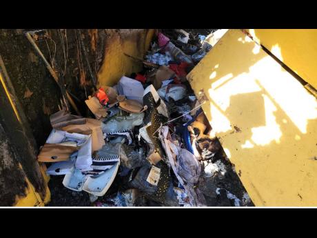 Damaged goods and appliances lay in disarray in the aftermath of the fire at the MoBay Arcade.