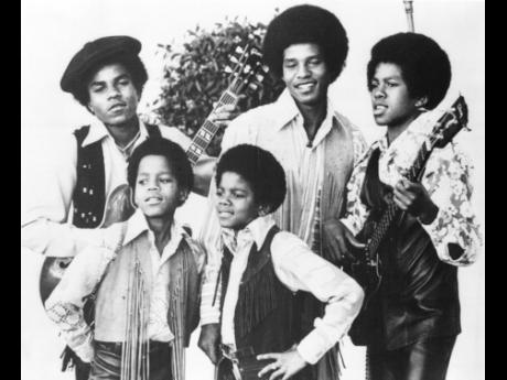 FILE - The Jackson 5, Michael Jackson, front right; Marlon Jackson, front left; Tito Jackson, back left; Jackie Jackson, back centre; and Jermaine Jackson, back right; pose for this undated photo together in Los Angeles.
