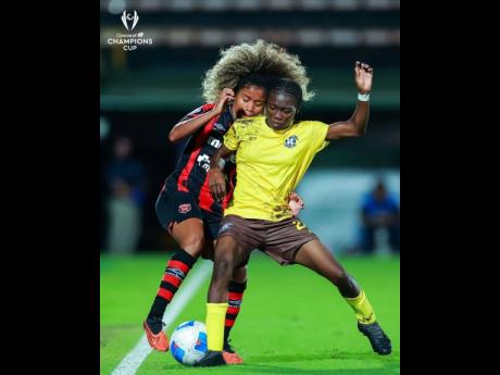 Frazsiers Whip’s Gillisha Gilbert (right) shields the ball away from an Alajuense player during their Concacaf Women’s Champions Cup encounter at the Estadio Alejandro Morera Soto in Costa Rica recently. 