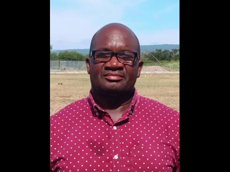 Garfield Carney, coach of Denbigh High.