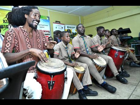 Kingston High School drummers performing at the launch of the Peace Gardens Competition in observation of International Day of Peace at Kingston High School on King Street, Kingston, on Friday. 