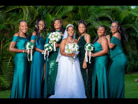Credit: Miguel Gayle Photography Dressed in white, the beautiful bride is joined by her bridal party that was happy to support her new chapter.