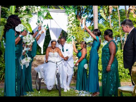 Credit: Miguel Gayle Photography In celebration of their happily ever after, Mr and Mrs Haynes rode off into the sunset together on a tricycle.